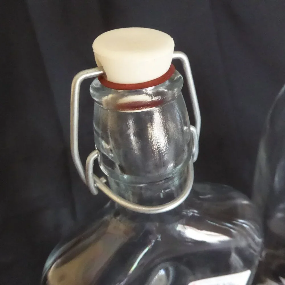 NEW 12.5” - 9.5” CRATE BARREL ITALY CLEAR GLASS AIR TIGHT LOCKING TOP 3 BOTTLES